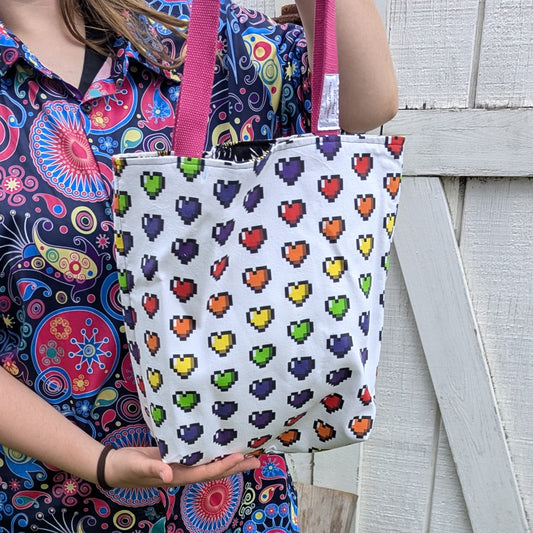 Pride Reversible Tote Bags Pixel Hearts and Edward Gorey Flowers
